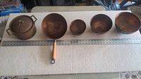 Top-down photo showing the Revere Ware copper pot with lid and the nested copper bowls including the whisking bowl with wooden handle, measuring approximately 39cm wide from pot handle to handle.