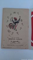 Original packaging cover showing rooster and cocktail glasses design and product details: Set of Eight Cocktail Napkins by Leacock, fine Irish linen, hand printed and finished, Rollins House, copyright 1965.