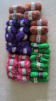 Top view of all skeins showing grouping and variety of yarn colors and textures