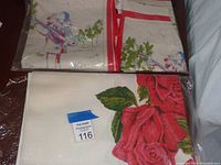 Photo of packaged vintage apron and tea towel set featuring colorful Pagliacci style musician playing violin and tree motifs.