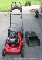 Front-angle view of mower body with collection bag removed