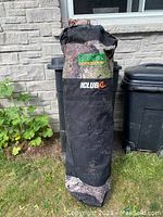 Packed Primos Club XL hunting tent inside black and camo fabric bag with Primos and Club XL logos shown.