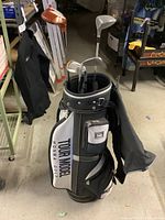 Full view of Honma Tour Model golf bag filled with golf clubs and accessories.