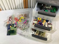 Overview of all golf accessories including tees, spike cleaning tools, and storage bin with drawers.