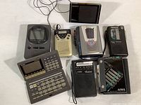 View of all 8 items together on a surface showing the range of devices in the lot