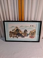 Full view of vintage shadow box framed art depicting Great Wall of China in a classic Oriental style, with detailed textured 3D elements and pastel mountain background.