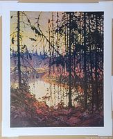 Full view of the limited edition print of Northern River by Tom Thomson showing the landscape with silhouetted trees and river.