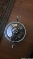 Top view of the silver plated sugar bowl with lid on, showing handle and round finial.