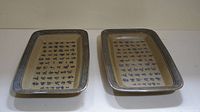 Pair of rectangular porcelain trays with blue border and Chinese characters arranged in vertical columns.
