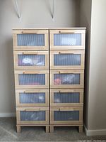 Front view of two matching chests side by side