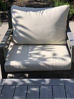 Front view of one chair showing cushion and frame