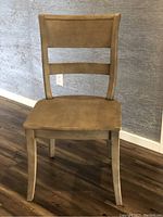 Front view of the Pottery Barn Bradford gray wash chair showing seat and curved backrest