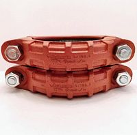 Two stacked orange ductile iron Victaulic 177N 6" Quickvic flexible couplings, showing bolts and embossed model information.