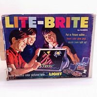 Vintage Lite-Brite original boxed set showing colorful logo and graphics with children playing.