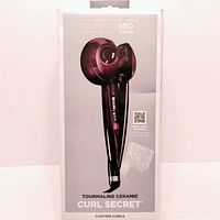 Photo of InfinitiPro Tourmaline Ceramic Curl Secret hair curler in original packaging with product image and branding visible