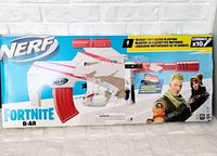 Front view of Fortnite Nerf Elite x10 B-AR motorized blasting blaster in original box with Fortnite character graphics and key features noted.