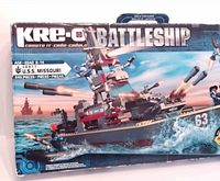 Box front showing KRE-O Battleship USS Missouri with 545 pieces noted. Illustration of battleship firing on ocean with minifigures.