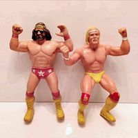 Both Hulk Hogan and Macho Man Randy Savage wrestling figures posed standing side by side showing full front view.