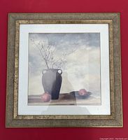 Framed artwork featuring a vase and branches with pomegranates, gold-toned chunky frame, size approx. 14.75 x 14.75 inches.