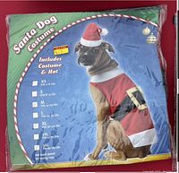 Photo of packaged Santa Dog Costume in size Medium with hat included, new in bag.