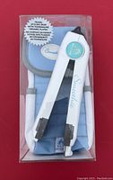 Photo of blue and white Smoothie travel hair styling iron with a blue and gray travel bag, packaged in clear box with label showing ceramic tourmaline plates.