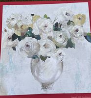 Photo of canvas painting showing white roses in a glass vase on a light background