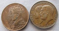 Obverse side of both medallions showing royal profiles and commemorative dates