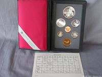 Canadian coin set displayed in black foam insert with six coins visible and one penny.