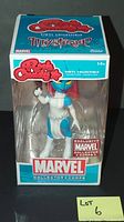 Front view of the Marvel Rock Candy Exclusive Mystique vinyl collectible in original packaging.