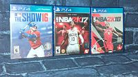 Photo of three PS4 sports games: MLB The Show 16, NBA 2K17, and NBA 2K18.