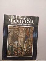 Front cover of the book featuring a detailed fresco painting from Mantegna's work in the Eremitani Church, Padua.
