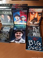 Photo of DVDs and CDs including Inspector Lewis, Perry Mason, Poirot collections, The King's Speech, and music CDs The Who and Aerosmith.