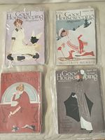Four vintage Good Housekeeping magazines dated 1913-1915 in plastic covers, showing various illustrated covers including women and winter scenes.