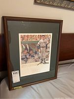 Framed print titled "Bottom of the Ninth" showing a Chicago baseball scene with players in dugout and on field, with a brown wooden frame and green matting.