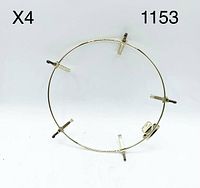 Four gold-plated circular spring-load plate hangers, each with four adjustable clips, arranged with one hanger displayed prominently to show structure and clips.