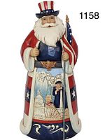 Photo of the Enesco Jim Shore Heartwood Creek America Santa Around The World figurine showing the full front view with American patriotic designs.