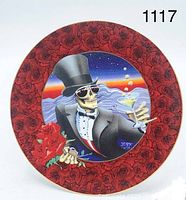 Front view of decorative plate showing skeleton in tuxedo and top hat holding martini glass and bouquet of roses, surrounded by a red rose pattern on the rim.