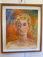 Full view of the framed oil on canvas portrait painting of a youth with colorful abstract background.