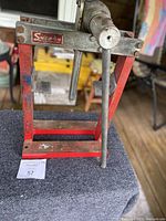 Full view of the Snap-On arbor press showing the frame and lever in detail.