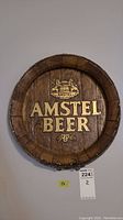 Front view of 15-inch Amstel Beer resin sign shaped like a barrel with detailed wood texture and gold lettering.