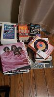 Stack of assorted music books including All Music Guide, DVD & Video book, Jeff Rubin book, and Pink Floyd biography.
