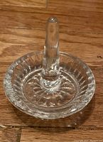 Clear glass ring holder with central cone for rings, fluted dish base