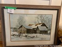 Framed winter barn landscape painting showing full lot, under glass, wood frame with double mat