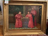 Front view of the oil painting showing three cardinals playing chess in gilt frame