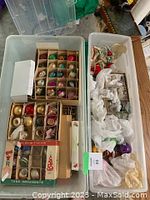 Overview of two boxes with assorted vintage glass ornaments