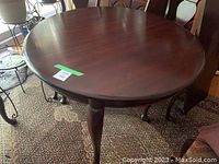 Round tabletop and leg visible from slightly above