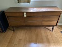 Full front view of the dresser showing all nine drawers and overall condition