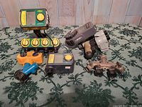 Overview of the watering timers and hose splitters including two electronic timers, multiple hose splitters in plastic and metal.