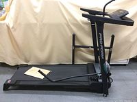 Side view of the Pro-Form Crosswalk LT treadmill showing running belt, frame, and upper body workout bars.