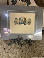 Framed limited edition etching with large gray mat and decorative stand